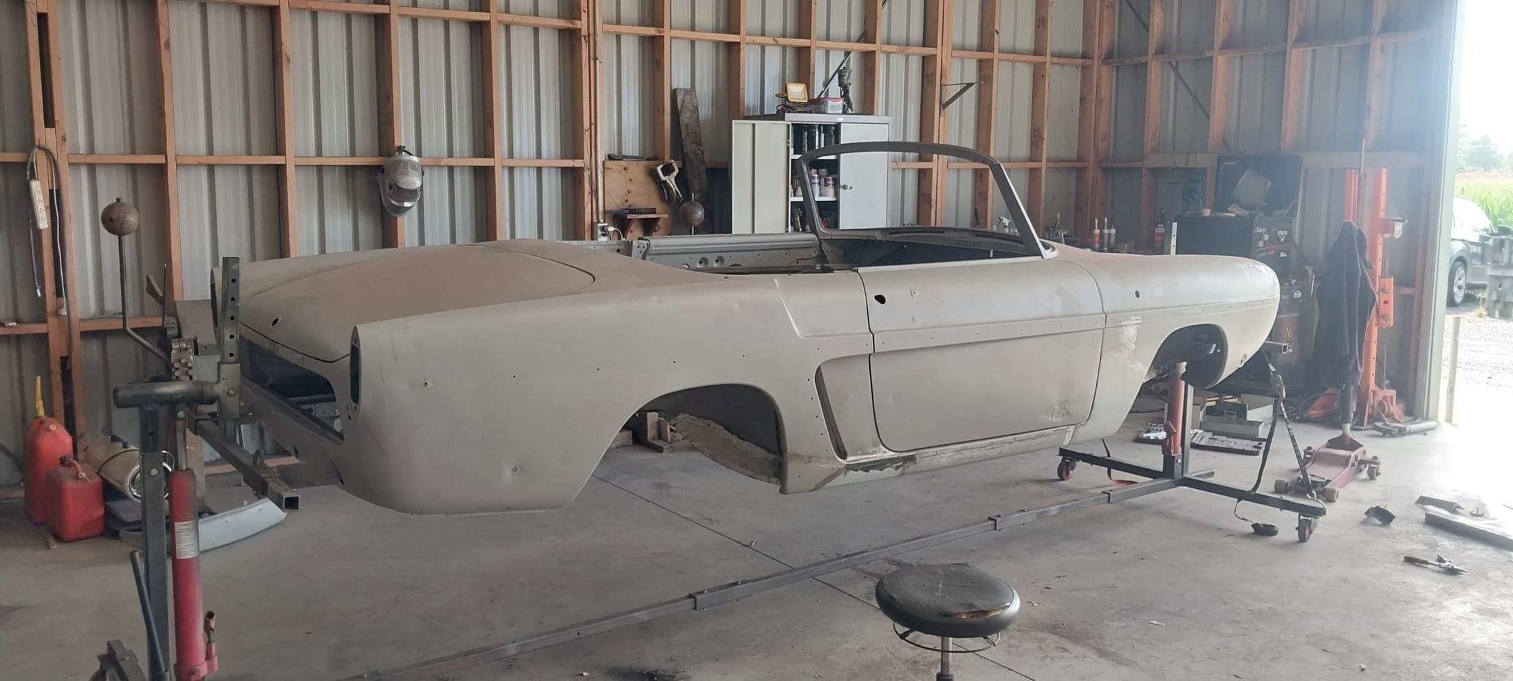 Convertible rebuild, Body in primer on the rotisserie, by Panel Beating Services