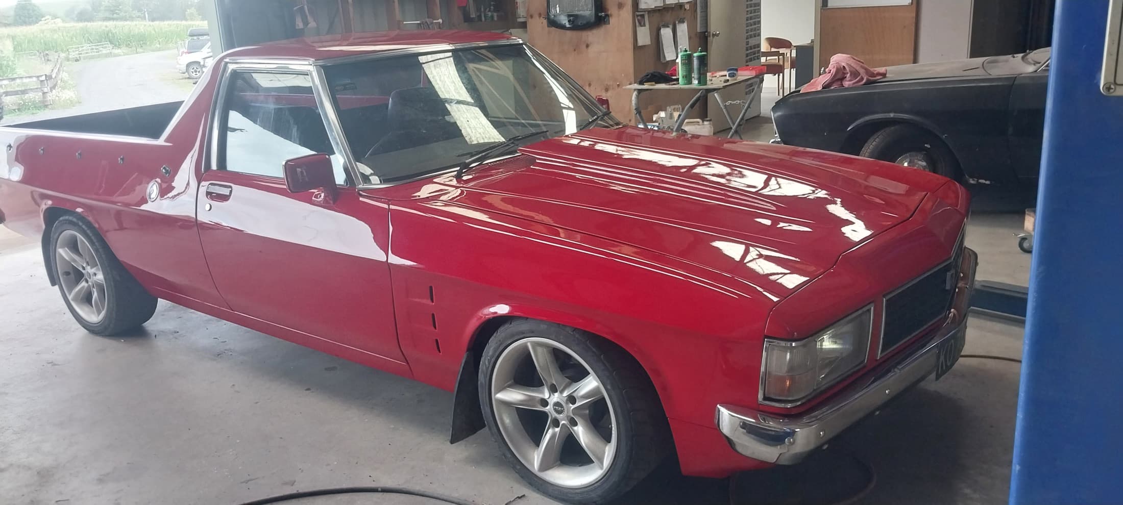Holden Ute, Lowered and finished in red, by Panel Beating Services